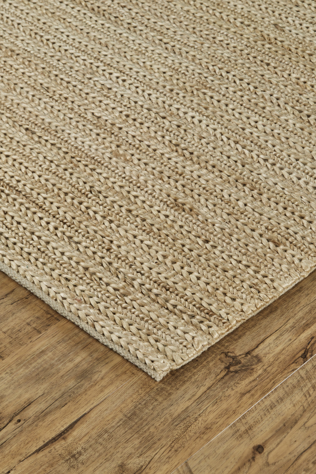5' X 8' Tan Ivory And Taupe Hand Woven Area Rug