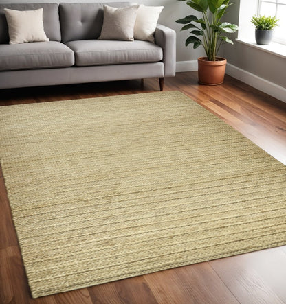 5' X 8' Tan Ivory And Taupe Hand Woven Area Rug