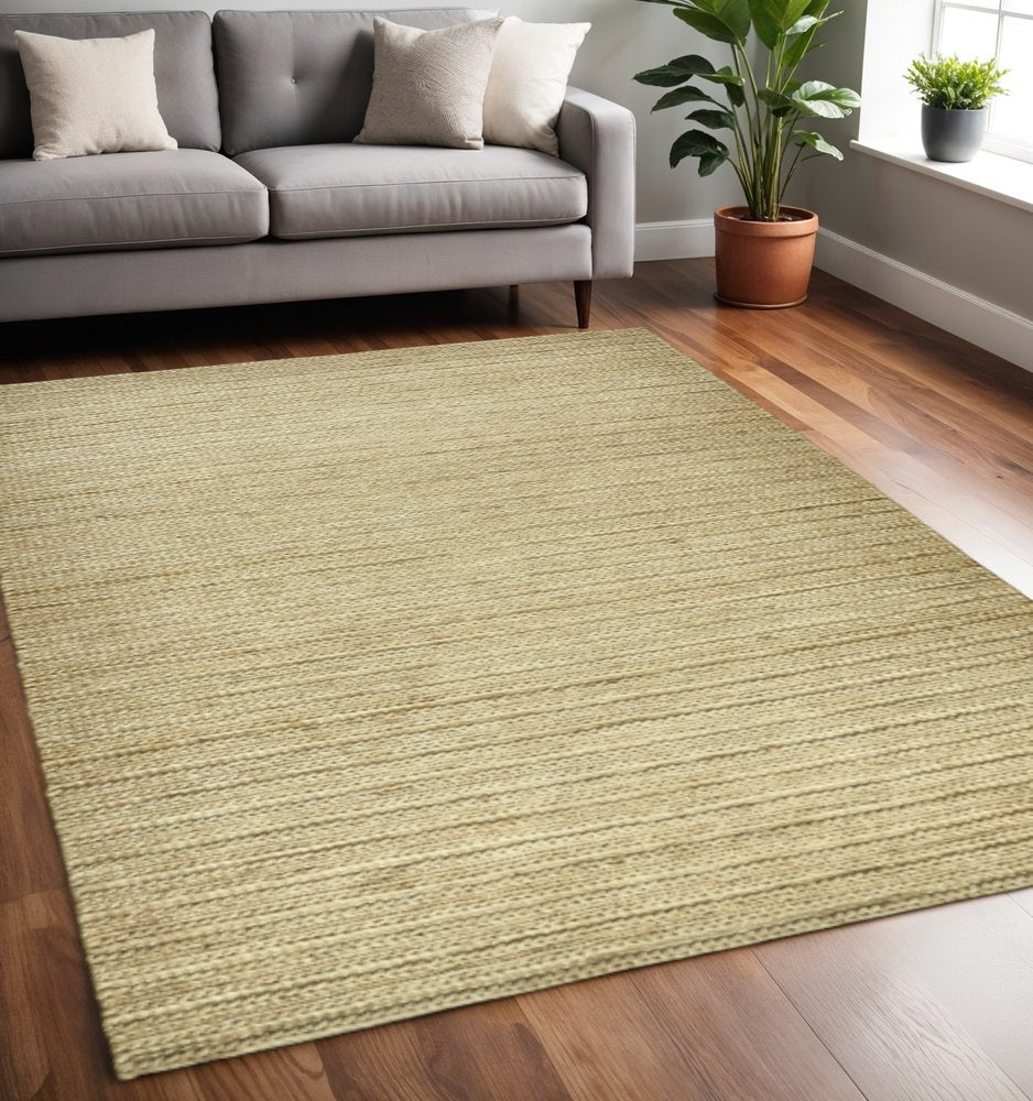 5' X 8' Tan Ivory And Taupe Hand Woven Area Rug