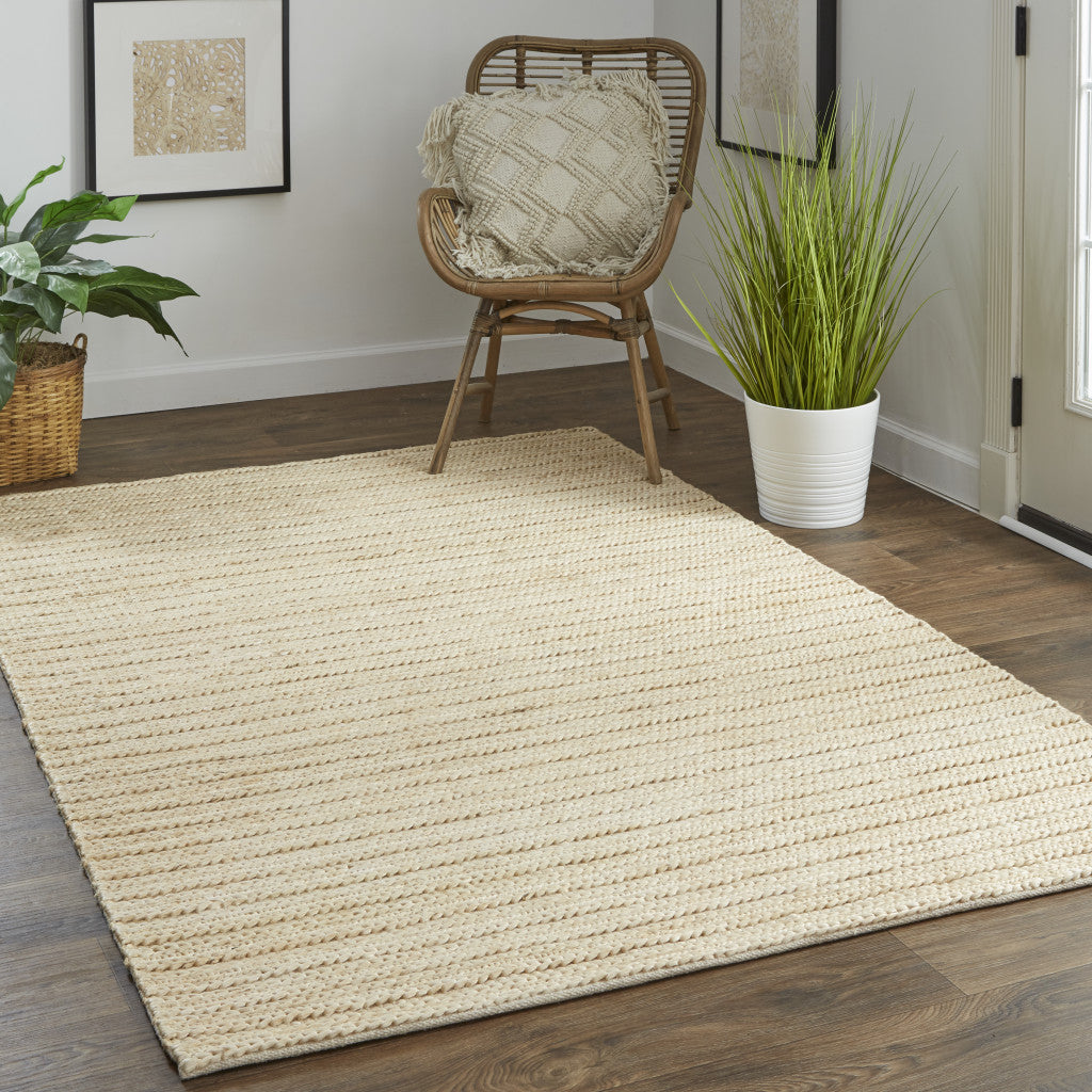 5' X 8' Tan Ivory And Taupe Hand Woven Area Rug