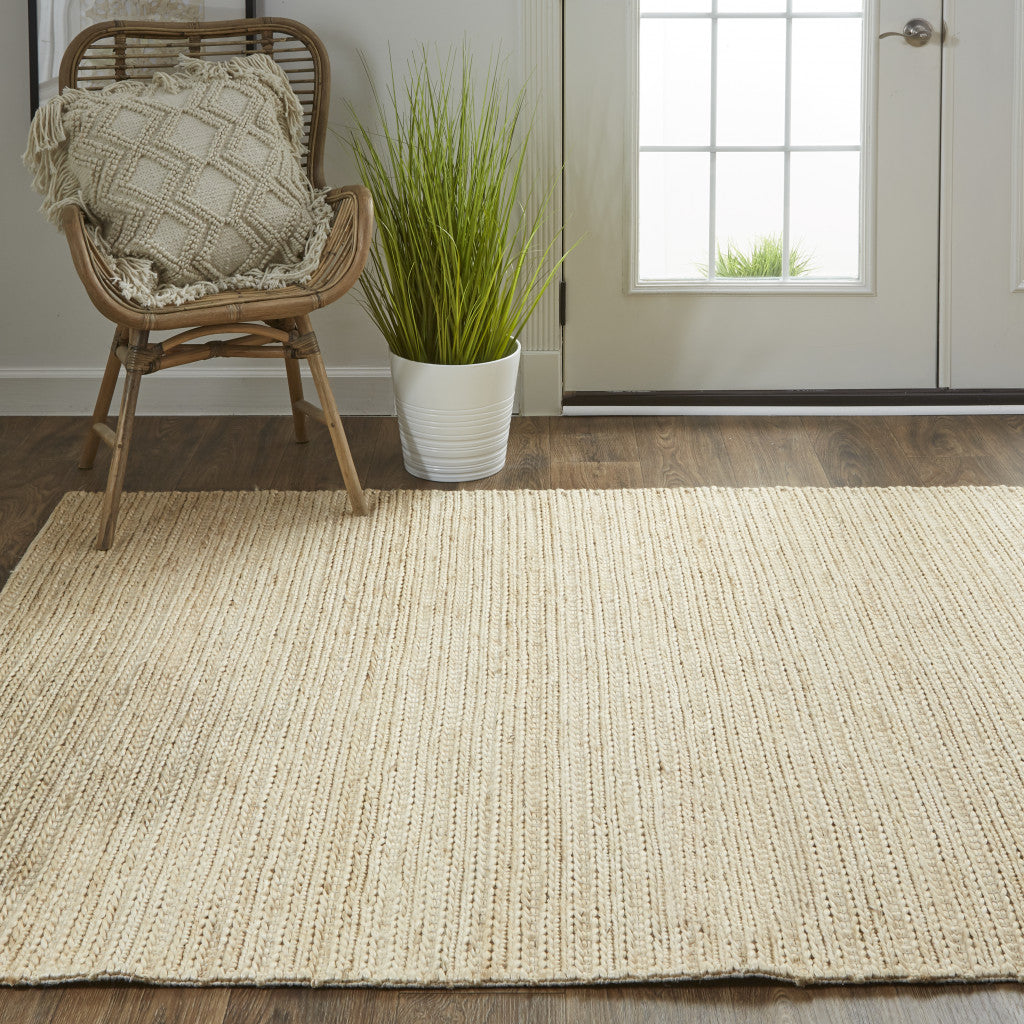 5' X 8' Tan Ivory And Taupe Hand Woven Area Rug