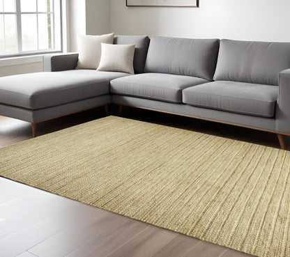 5' X 8' Tan Ivory And Taupe Hand Woven Area Rug