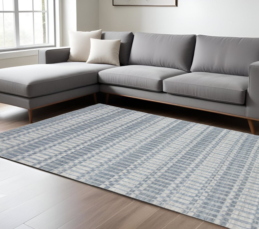 7' X 9' Ivory And Blue Striped Hand Woven Area Rug