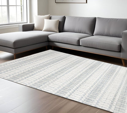 7' X 9' Ivory And Blue Striped Hand Woven Area Rug