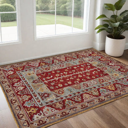 5' X 8' Red Blue And Brown Wool Floral Hand Knotted Distressed Stain Resistant Area Rug With Fringe