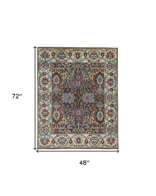 2' X 3' Ivory and Blue Wool Floral Hand Knotted Distressed Area Rug With Fringe