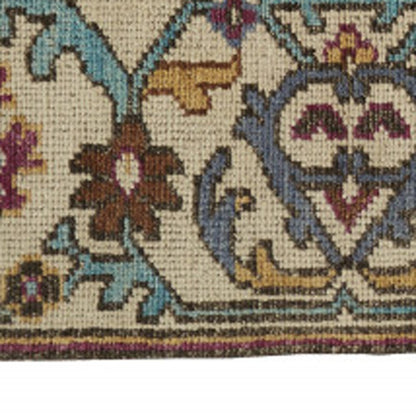 2' X 3' Ivory and Blue Wool Floral Hand Knotted Distressed Area Rug With Fringe