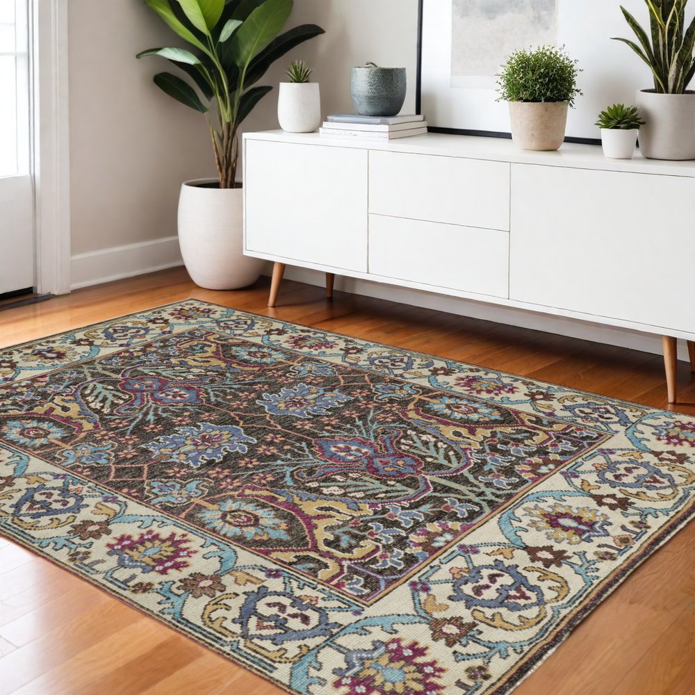 2' X 3' Ivory and Blue Wool Floral Hand Knotted Distressed Area Rug With Fringe