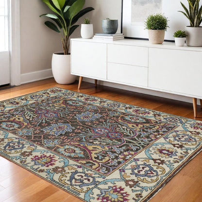 2' X 3' Ivory and Blue Wool Floral Hand Knotted Distressed Area Rug With Fringe