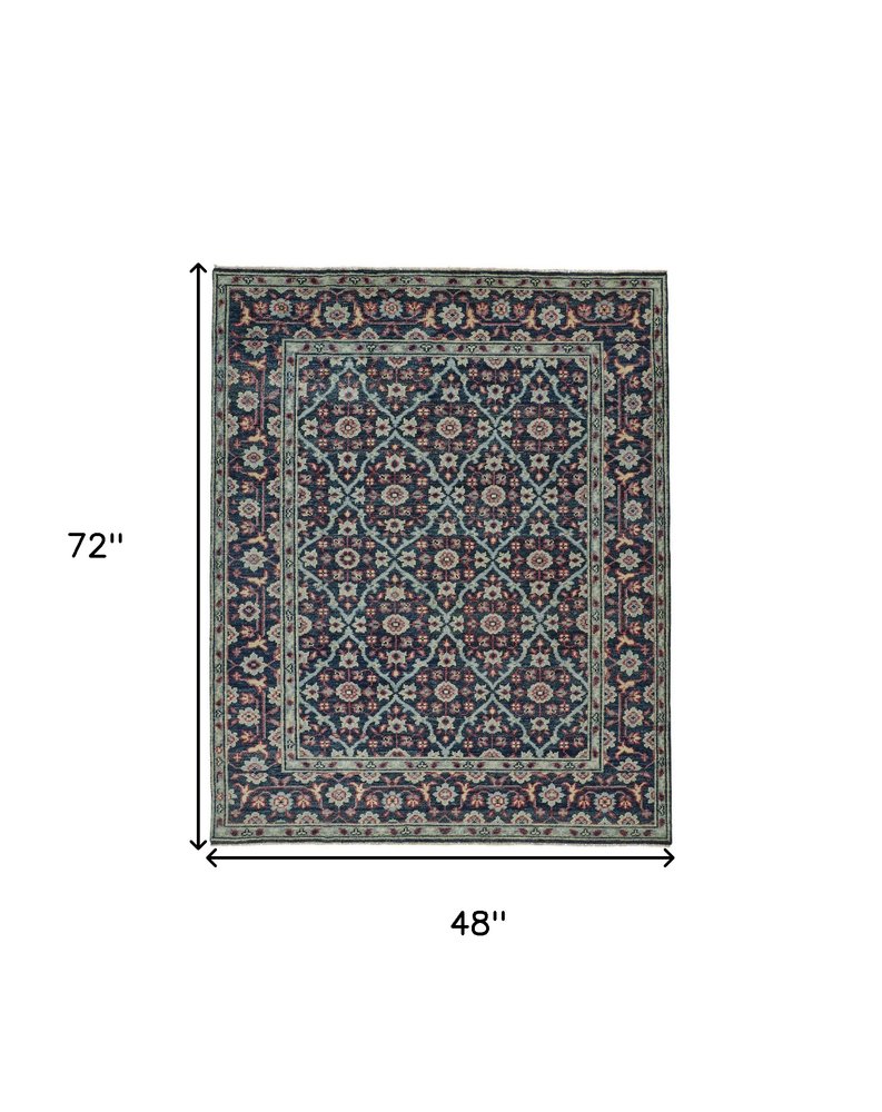8' X 10' Blue Green And Red Wool Floral Hand Knotted Distressed Stain Resistant Area Rug With Fringe