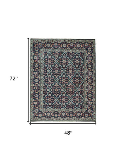 8' X 10' Blue Green And Red Wool Floral Hand Knotted Distressed Stain Resistant Area Rug With Fringe