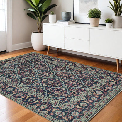8' X 10' Blue Green And Red Wool Floral Hand Knotted Distressed Stain Resistant Area Rug With Fringe