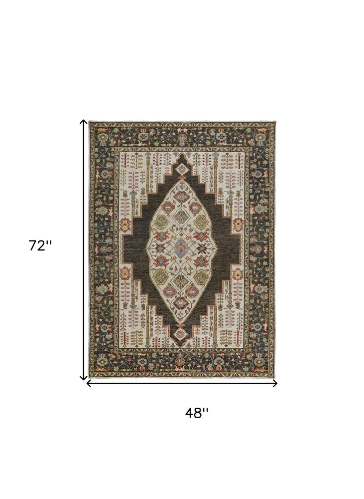 2' X 3' Green and Ivory Wool Floral Hand Knotted Distressed Area Rug With Fringe