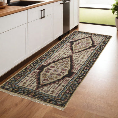 2' X 3' Green and Ivory Wool Floral Hand Knotted Distressed Area Rug With Fringe