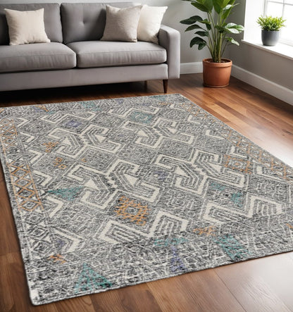 8' X 11' Black Ivory And Green Wool Geometric Hand Tufted Distressed Area Rug