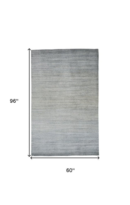 7' X 10' Gold Ivory and Gray Abstract Area Rug