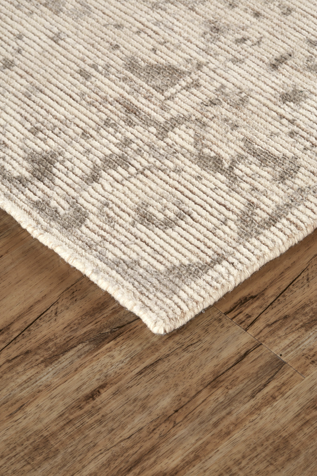 5' X 8' Ivory And Tan Abstract Hand Woven Area Rug