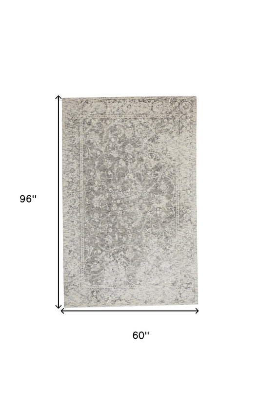 5' X 8' Ivory And Tan Abstract Hand Woven Area Rug