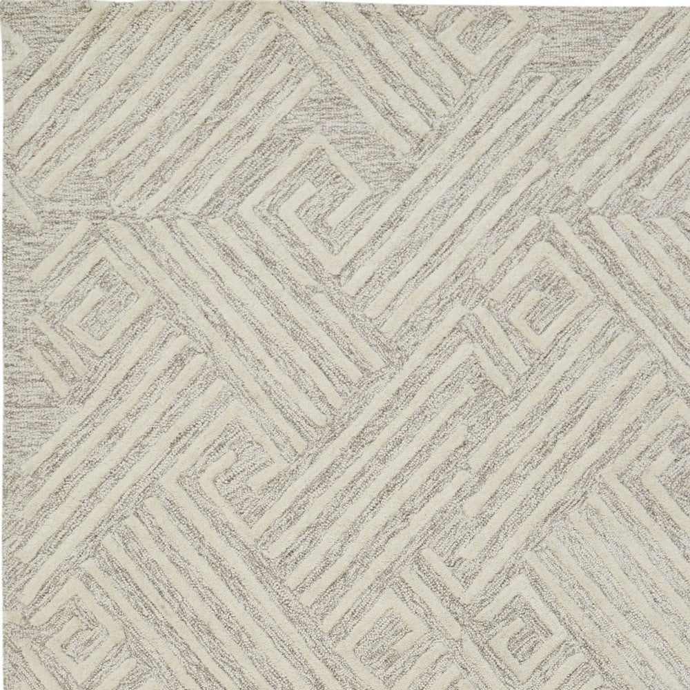 8' X 11' Tan And Ivory Wool Geometric Tufted Handmade Stain Resistant Area Rug