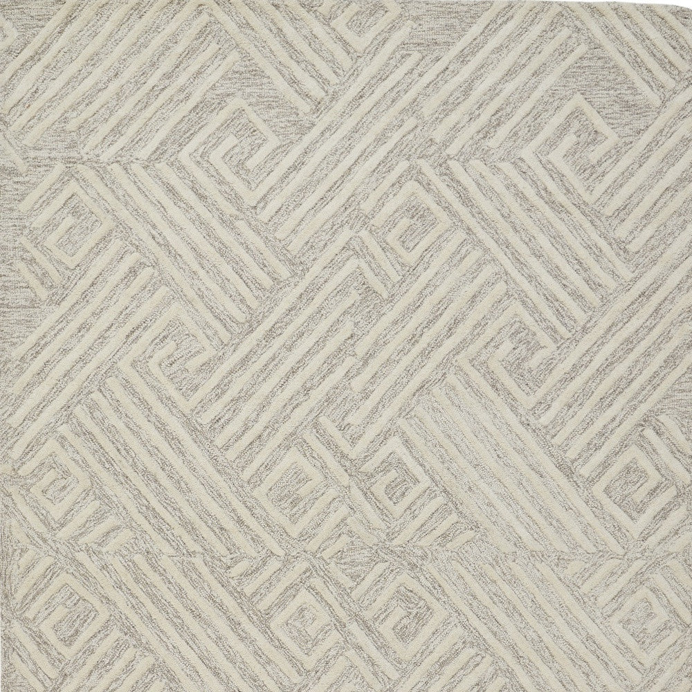 8' X 11' Tan And Ivory Wool Geometric Tufted Handmade Stain Resistant Area Rug