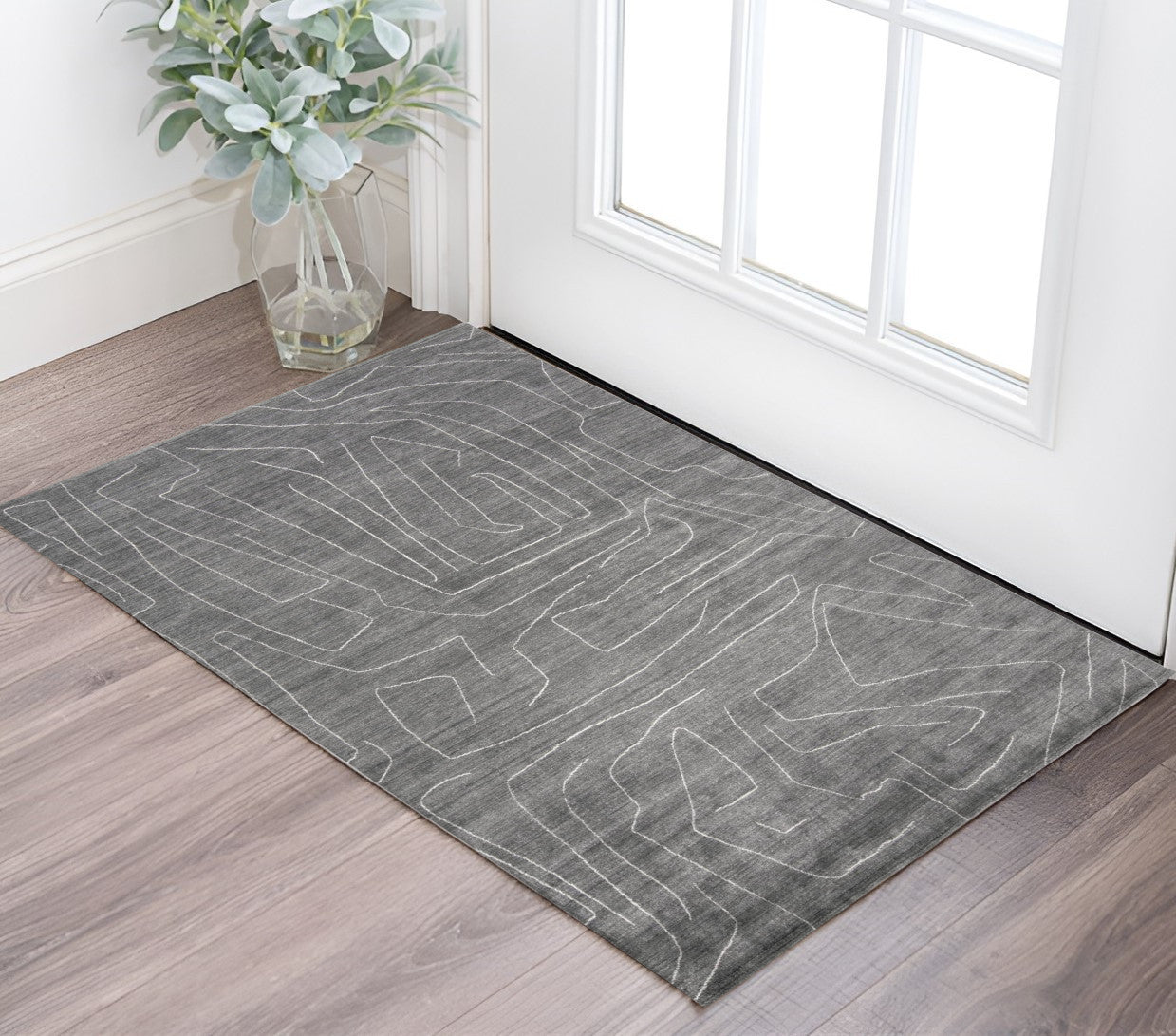 5' X 8' Gray And Ivory Abstract Hand Woven Area Rug