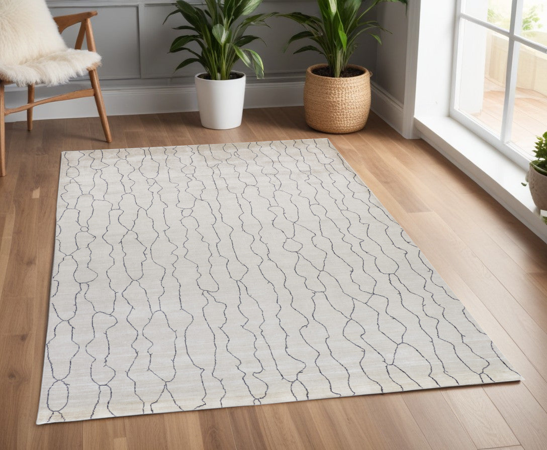 4' X 6' Gray and Ivory Abstract Hand Woven Area Rug