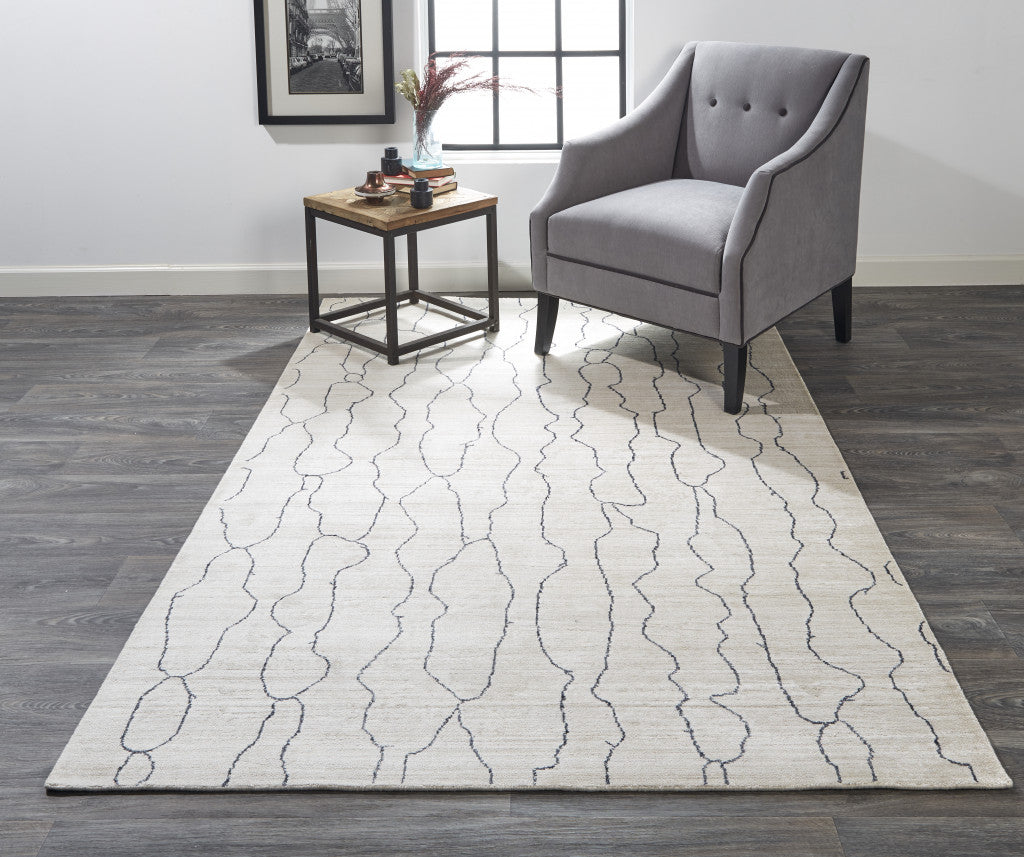 4' X 6' Gray and Ivory Abstract Hand Woven Area Rug