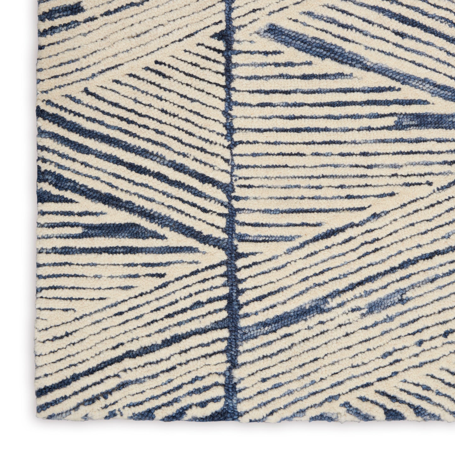 Cream textured runner rug with navy blue linear geometric pattern and thick pile.