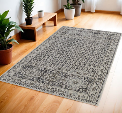 5' X 8' Ivory Taupe And Gray Abstract Stain Resistant Area Rug