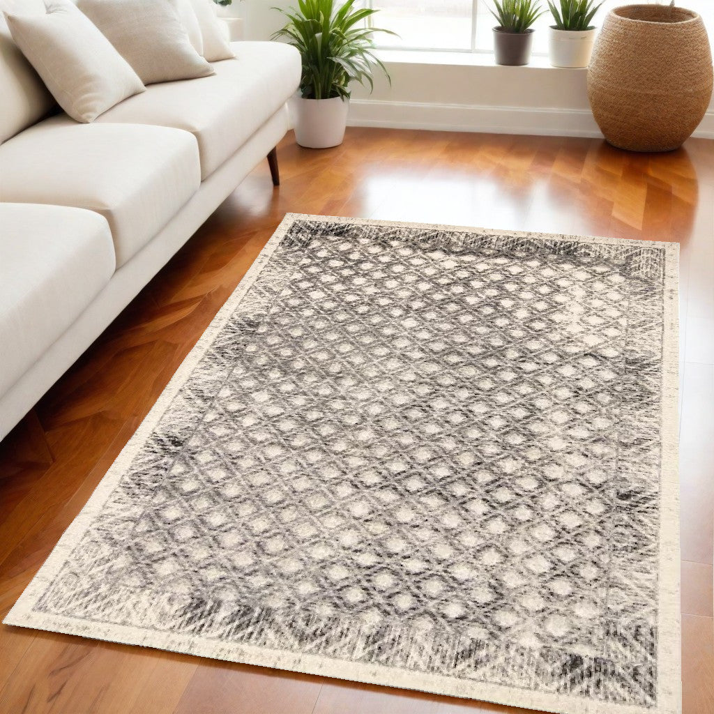 5' X 8' Ivory and Black Abstract Geometric Area Rug