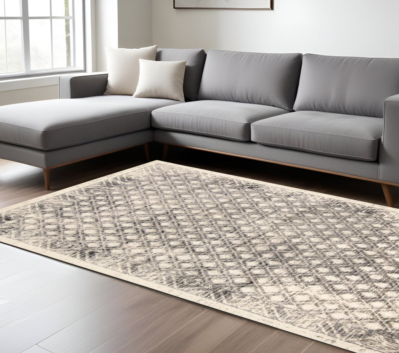 5' X 8' Ivory and Black Abstract Geometric Area Rug