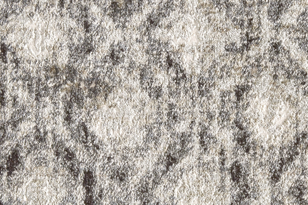 5' X 8' Ivory Black And Taupe Abstract Stain Resistant Area Rug