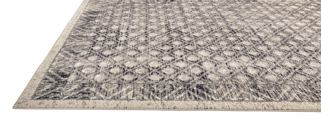 5' X 8' Ivory and Black Abstract Geometric Area Rug