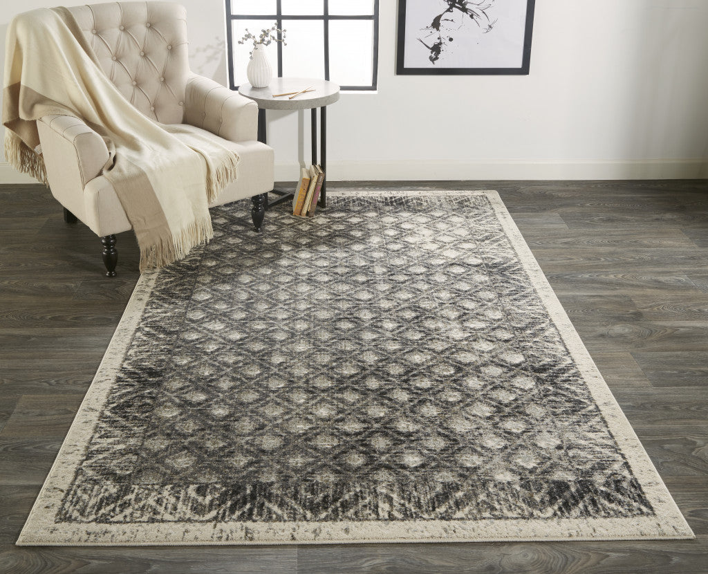 5' X 8' Ivory Black And Taupe Abstract Stain Resistant Area Rug