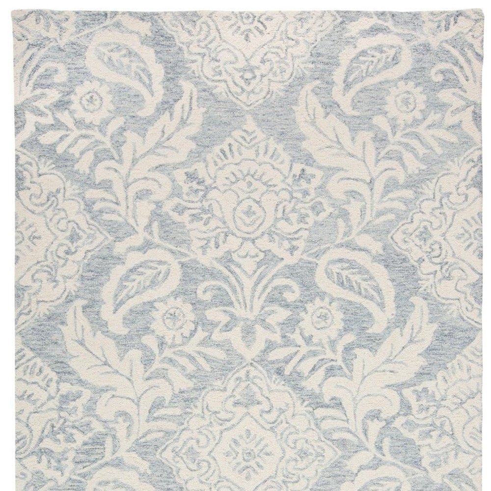 5' X 8' Blue And Ivory Wool Paisley Tufted Handmade Stain Resistant Area Rug