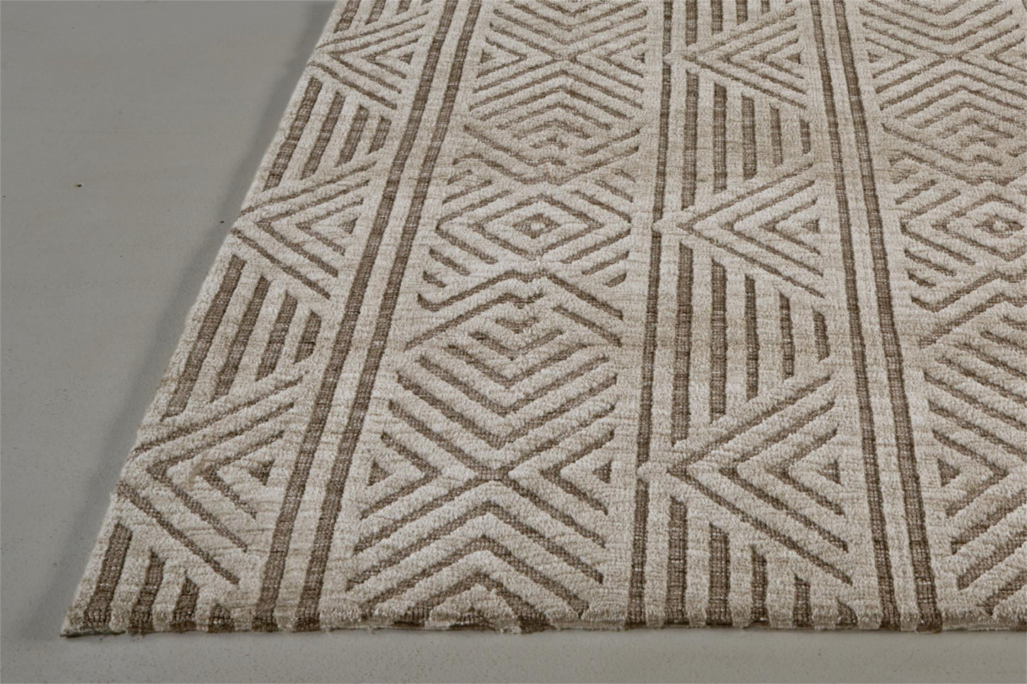 5' X 8' Tan Ivory And Brown Geometric Stain Resistant Area Rug