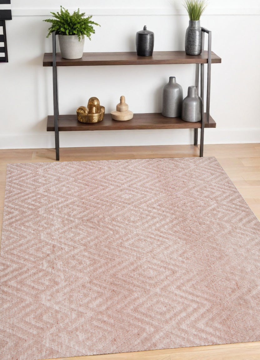 5' X 8' Pink And Ivory Geometric Stain Resistant Area Rug