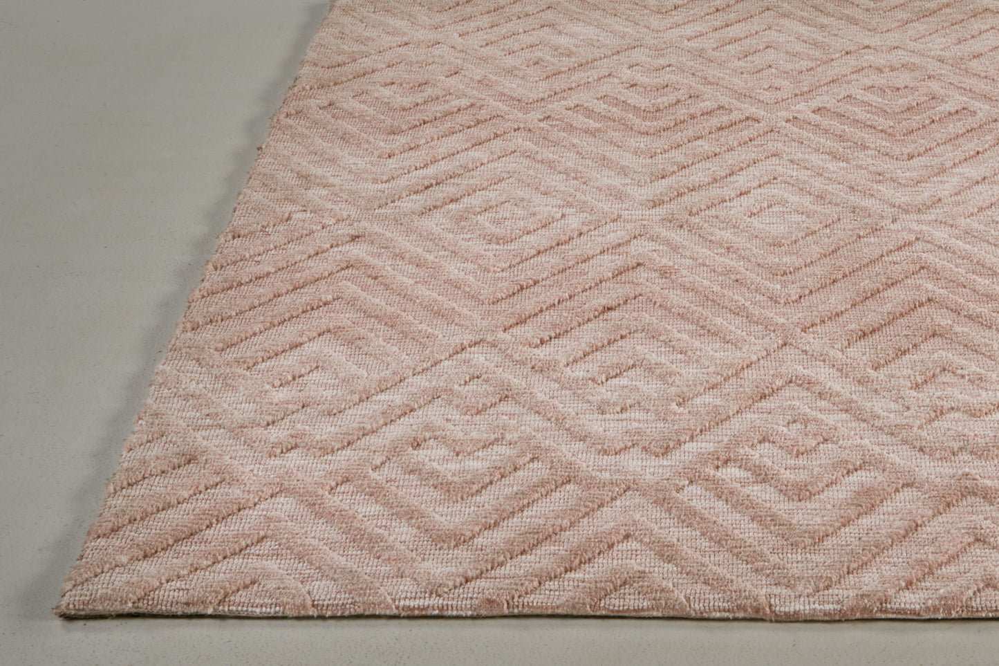 5' X 8' Pink And Ivory Geometric Stain Resistant Area Rug