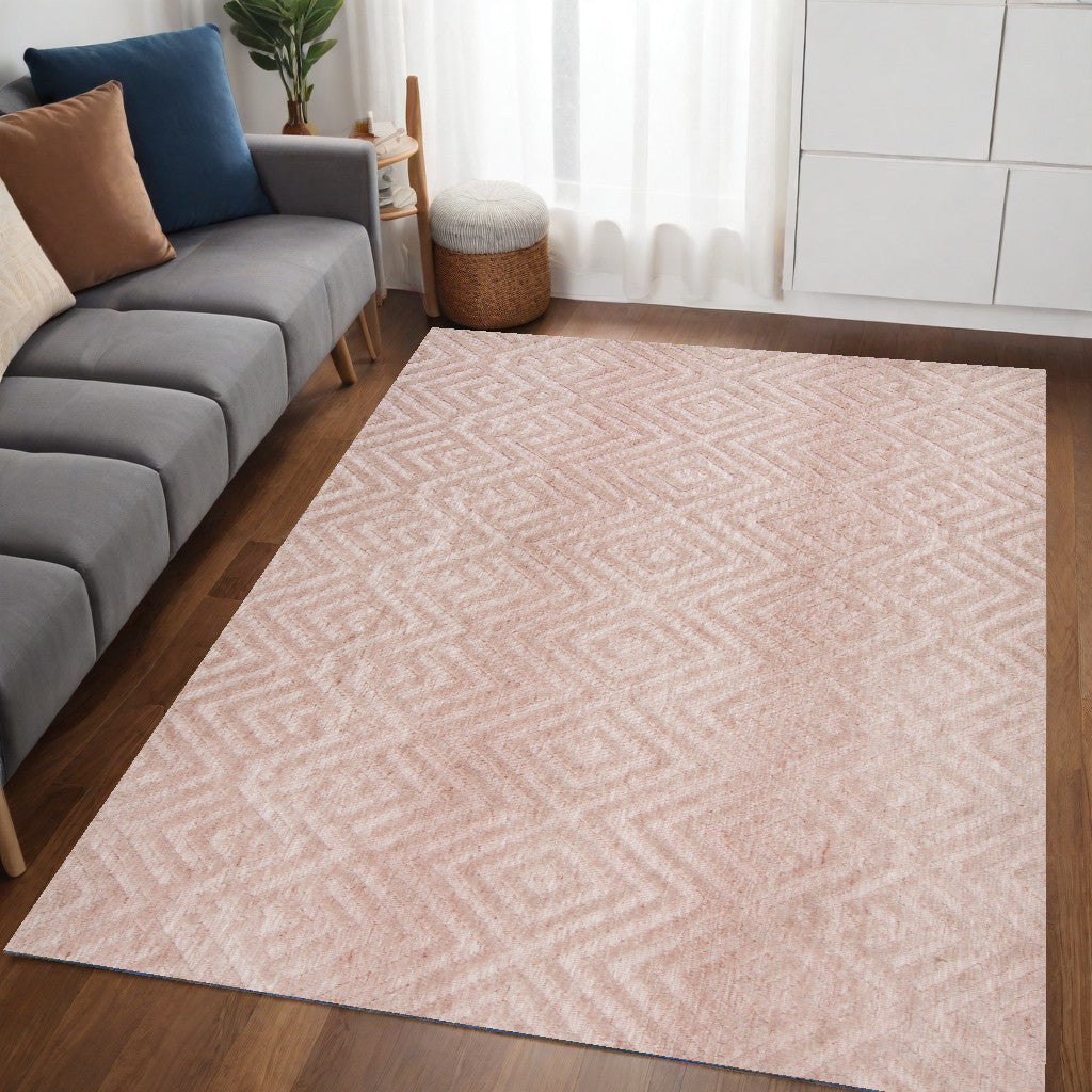 5' X 8' Pink And Ivory Geometric Stain Resistant Area Rug