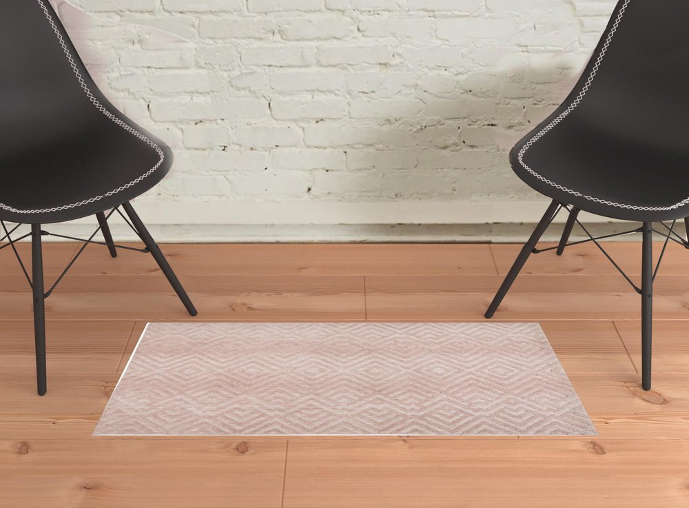 5' X 8' Pink And Ivory Geometric Stain Resistant Area Rug