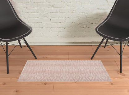 5' X 8' Pink And Ivory Geometric Stain Resistant Area Rug