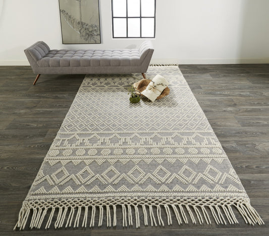 5' X 8' Ivory And Tan Wool Geometric Hand Woven Area Rug With Fringe