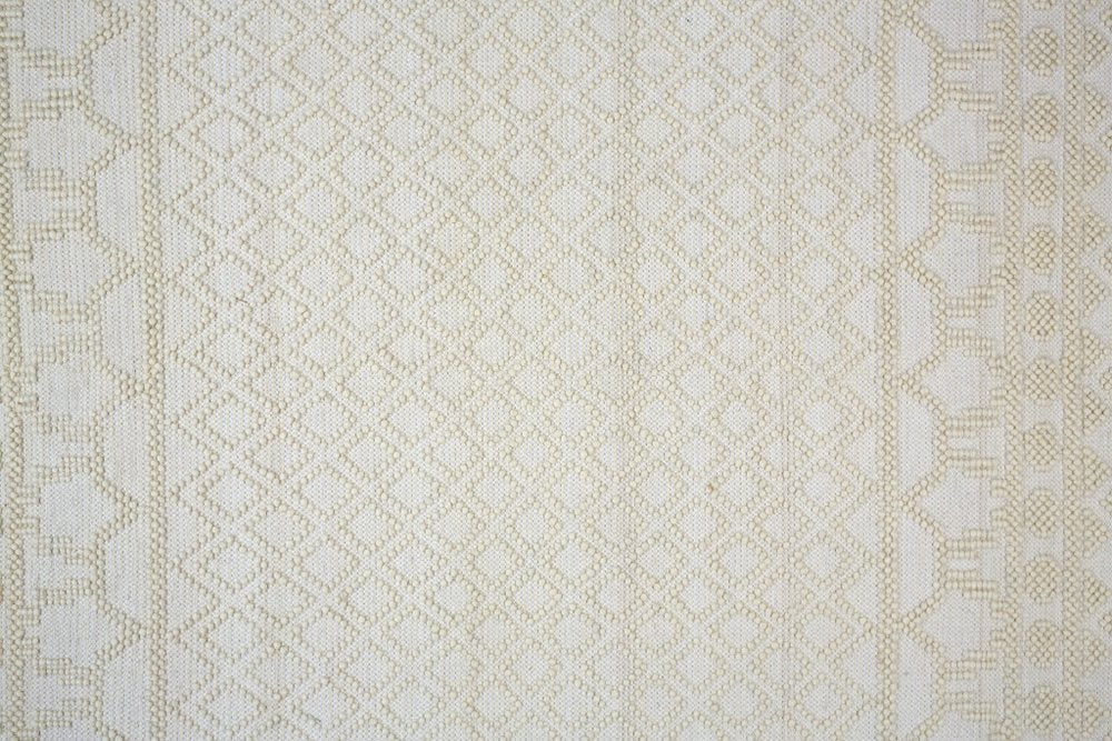 5' X 8' Ivory Wool Geometric Hand Woven Area Rug With Fringe