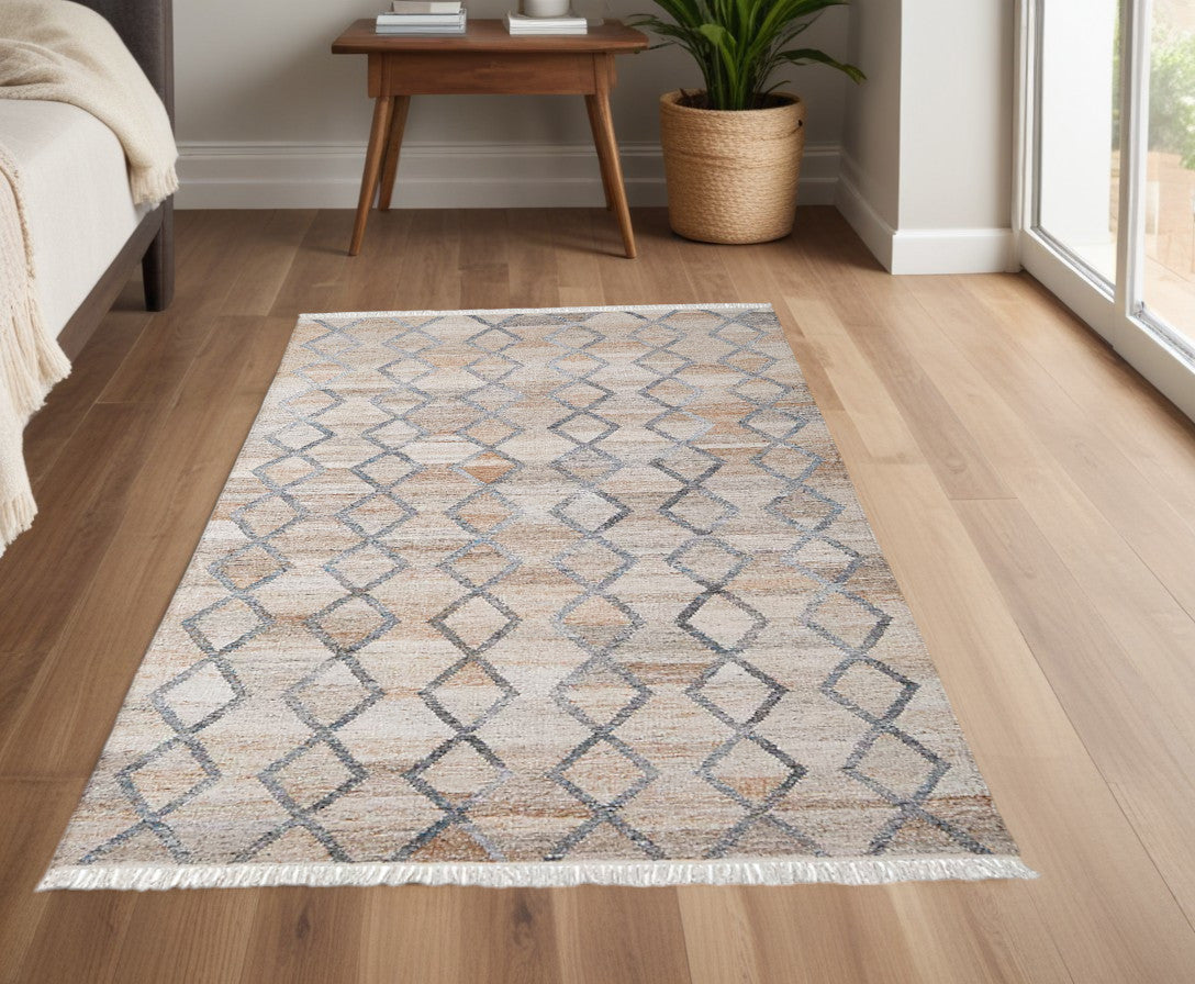 4' X 6' Gray Ivory And Tan Geometric Hand Woven Stain Resistant Area Rug With Fringe