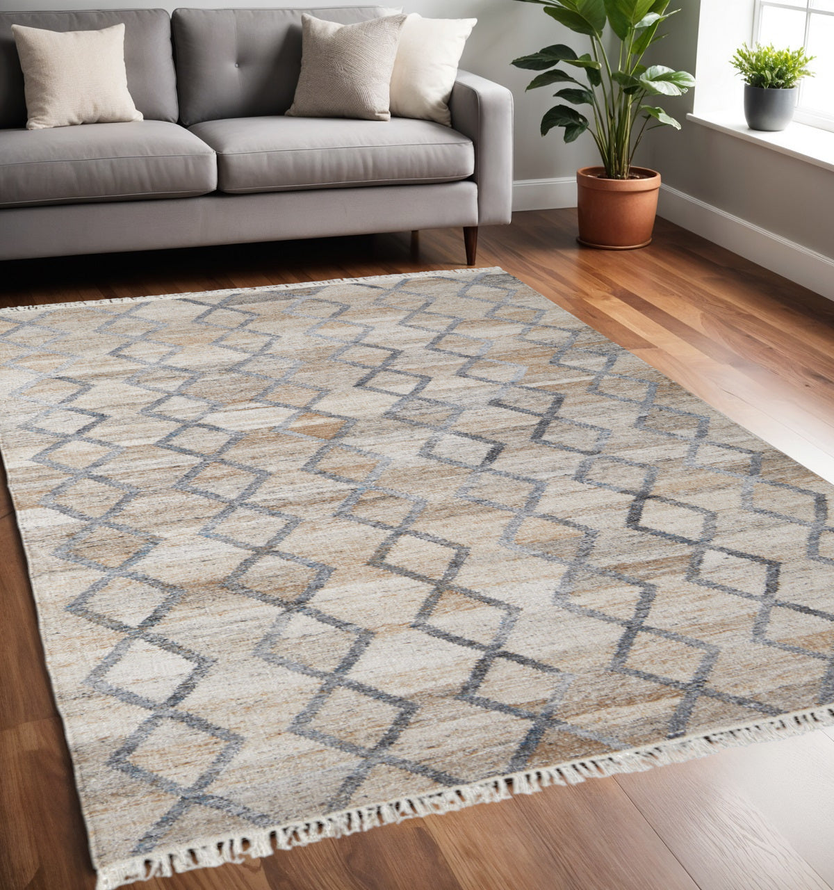 4' X 6' Gray Ivory And Tan Geometric Hand Woven Stain Resistant Area Rug With Fringe