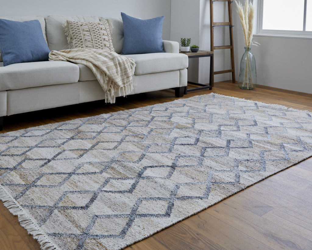 4' X 6' Gray Ivory And Tan Geometric Hand Woven Stain Resistant Area Rug With Fringe