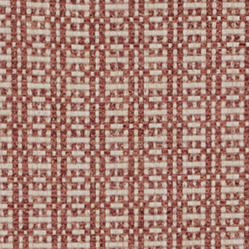 Rust and ivory woven fabric with a repeating geometric lattice pattern, upholstery fabric.
