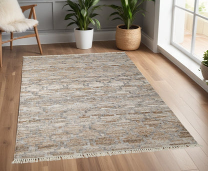 10' X 13' Tan Gray And Ivory Geometric Hand Woven Stain Resistant Area Rug With Fringe