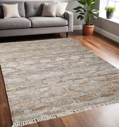 10' X 13' Tan Gray And Ivory Geometric Hand Woven Stain Resistant Area Rug With Fringe
