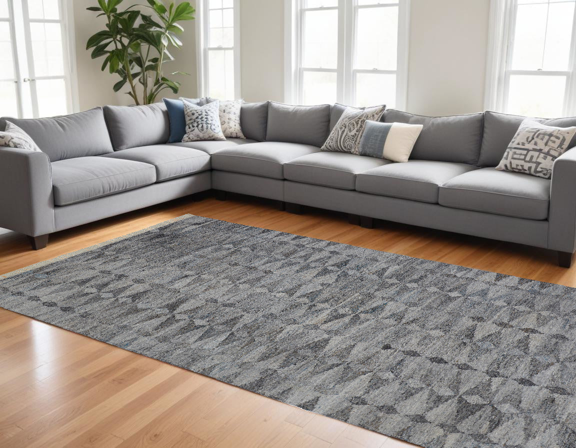 4' X 6' Gray Silver And Ivory Geometric Hand Woven Stain Resistant Area Rug With Fringe